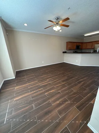 a kitchen with wooden cabinets and stainless steel appliances