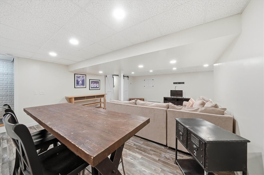 26 Davis Circle Warwick, RI 02886 - Photo 35 of 50 The expansive open layout easily accommodates multiple living zones, while the custom-designed craft room showcases built-in cabinetry and designer barn doors.