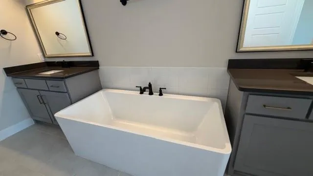 a bathroom with a bathtub and a sink
