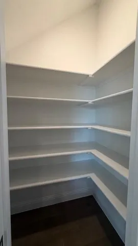 a storage room with wooden floor