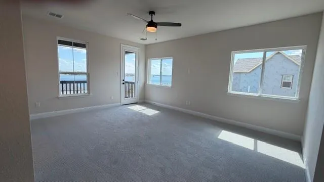 a view of an empty room with a window