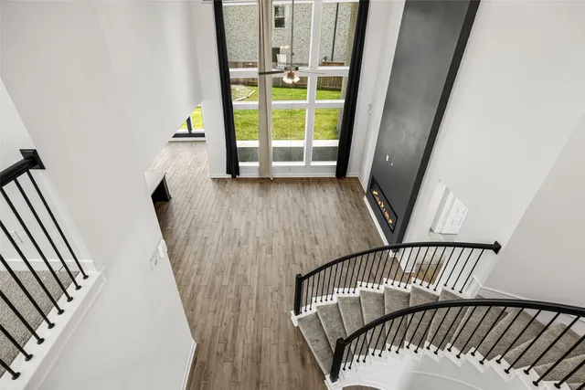 a view of a balcony with wooden floor