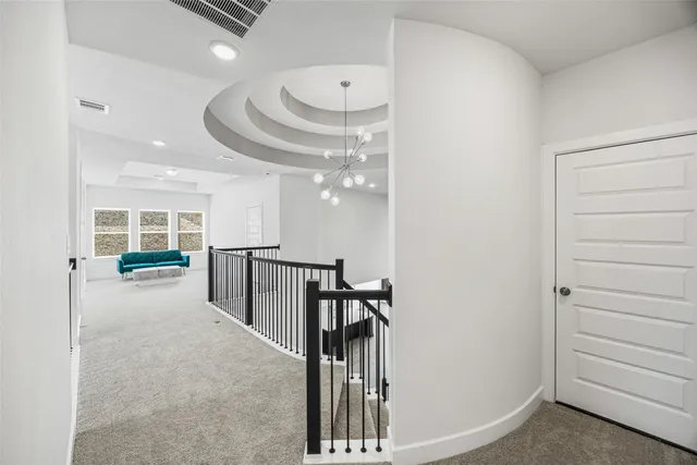 a view of a hallway with seating area