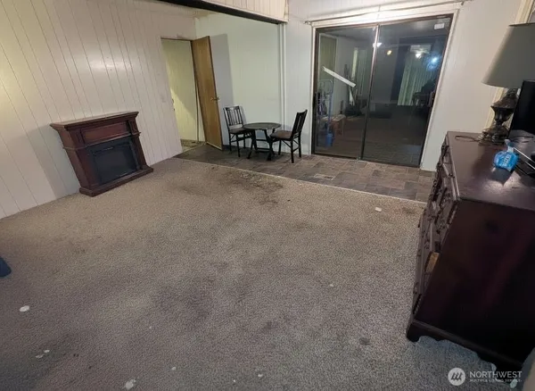 a room with furniture and a flat screen tv