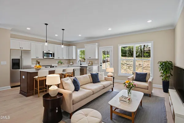 a kitchen with a sink cabinets and window