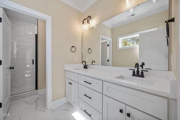 a bedroom with a bed couch and a window