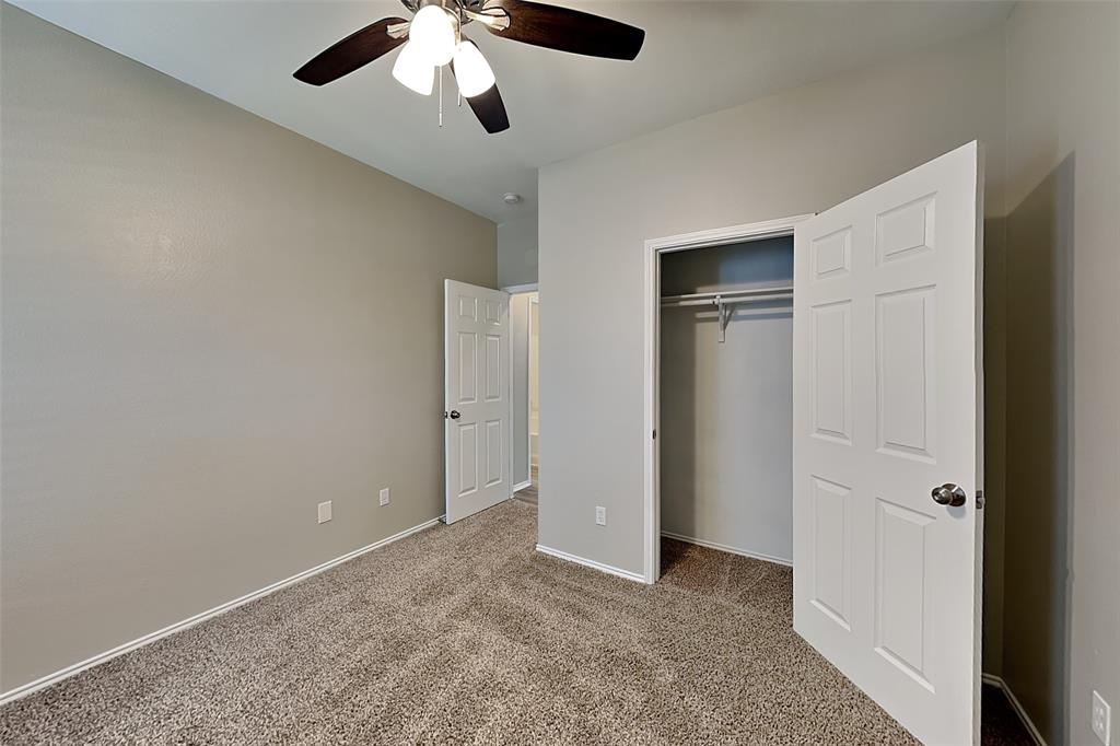 7016 Raintree Way Denton, TX 76210 - Photo 15 of 18 an empty room with closet area