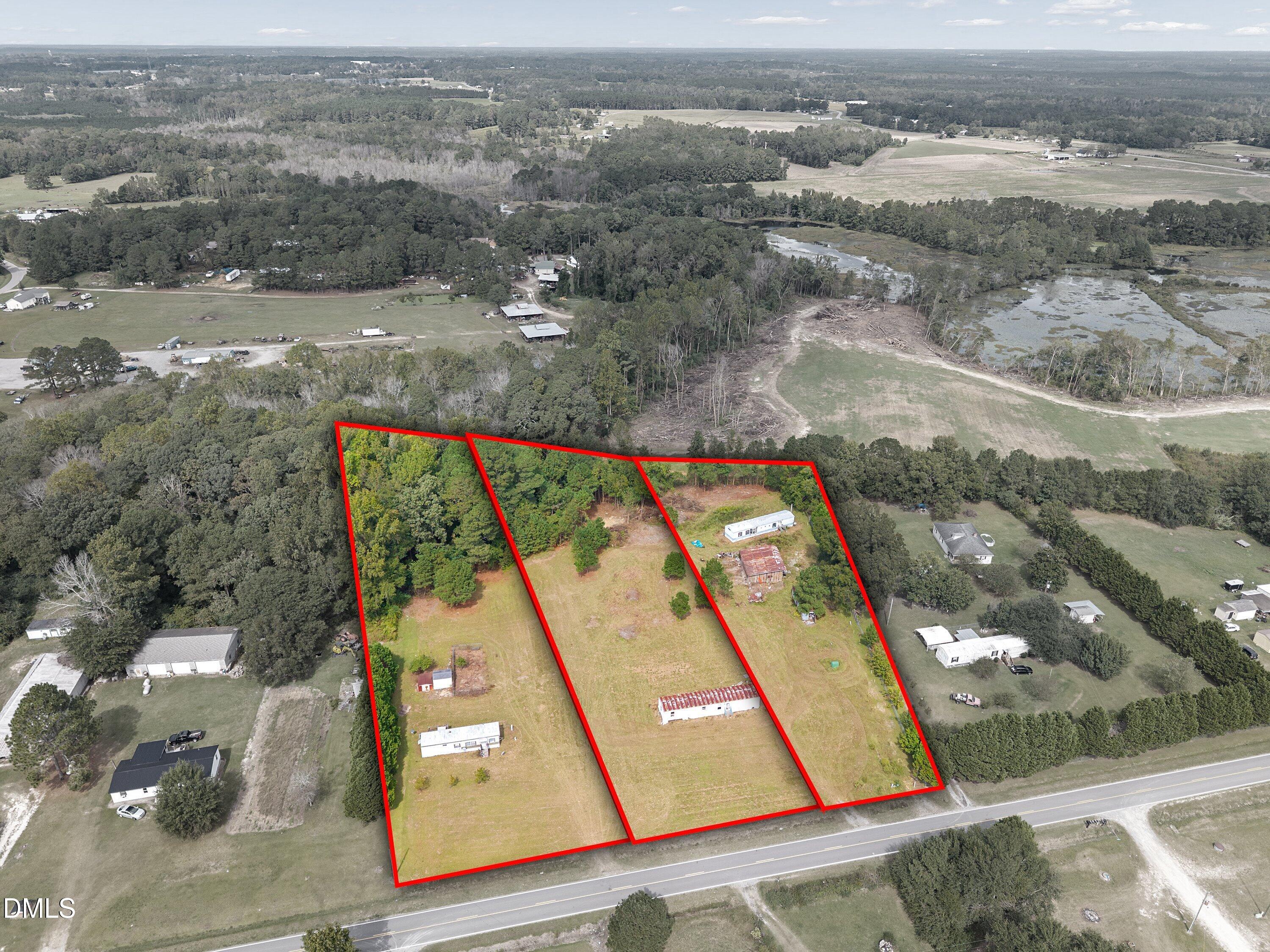 430 Webb Mill Road Four Oaks, NC 27524 - Photo 1 of 6 an aerial view of residential houses with outdoor space