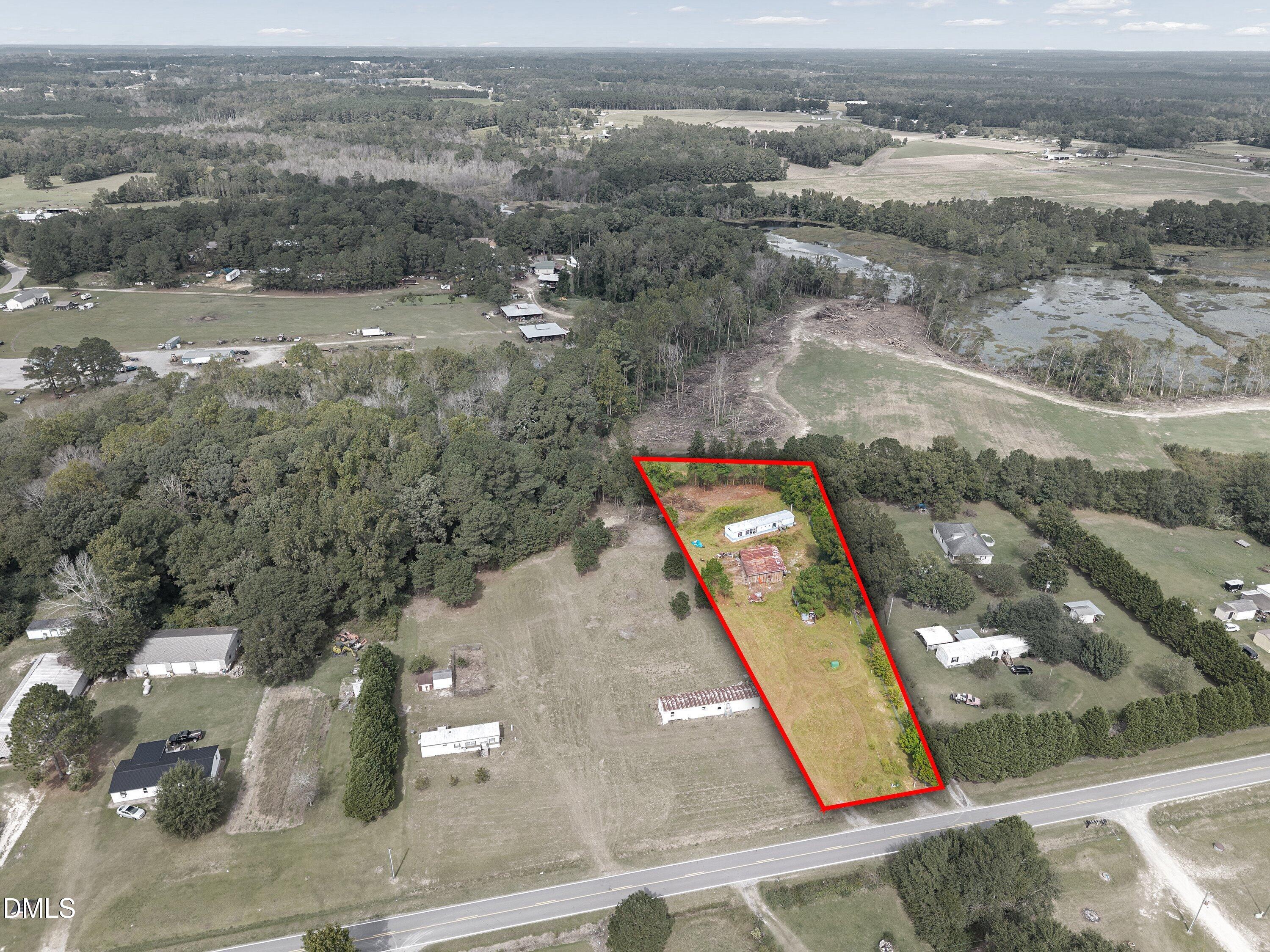 430 Webb Mill Road Four Oaks, NC 27524 - Photo 2 of 6 an aerial view of residential houses with outdoor space