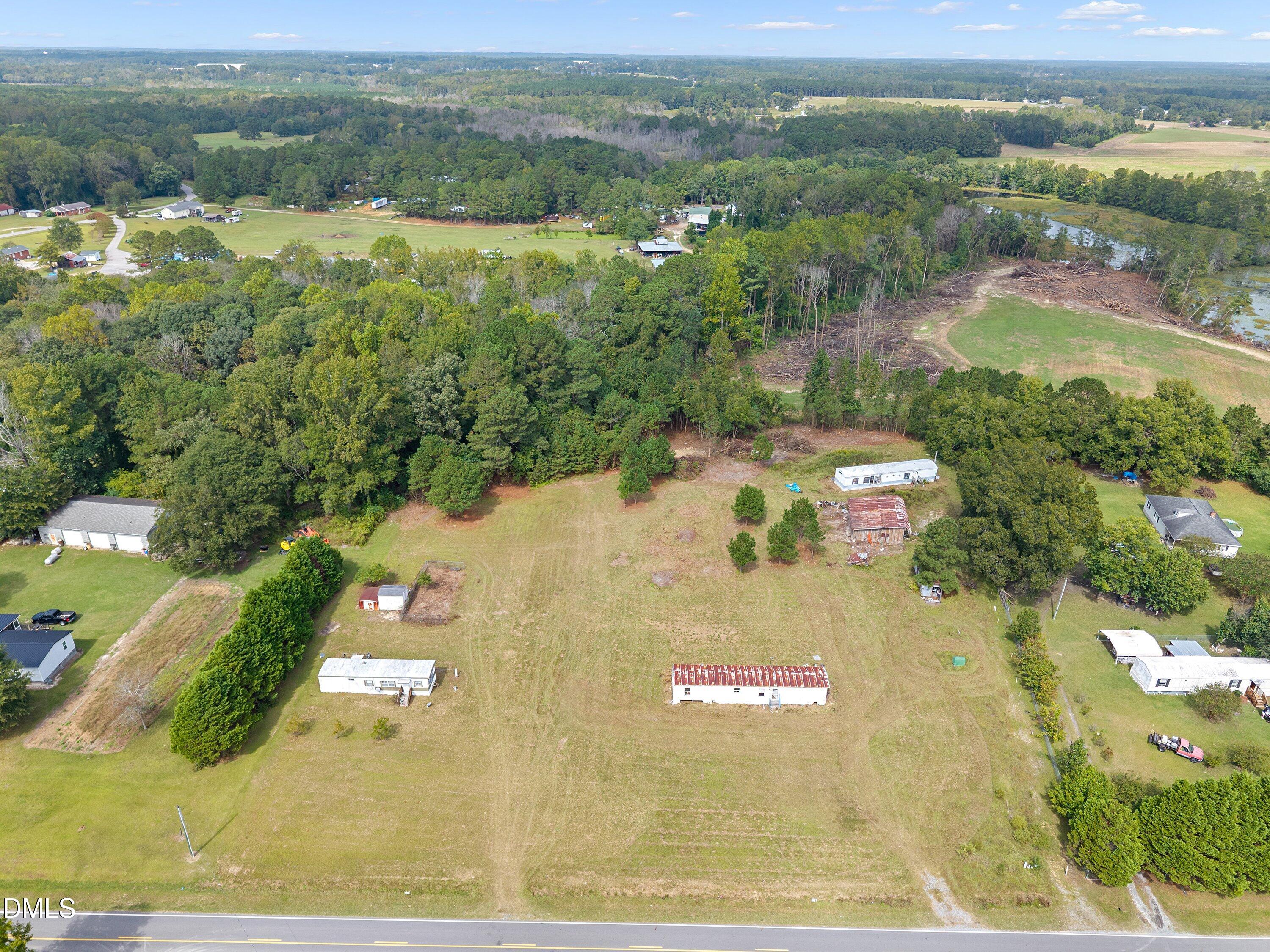 430 Webb Mill Road Four Oaks, NC 27524 - Photo 3 of 6 an aerial view of residential houses with outdoor space