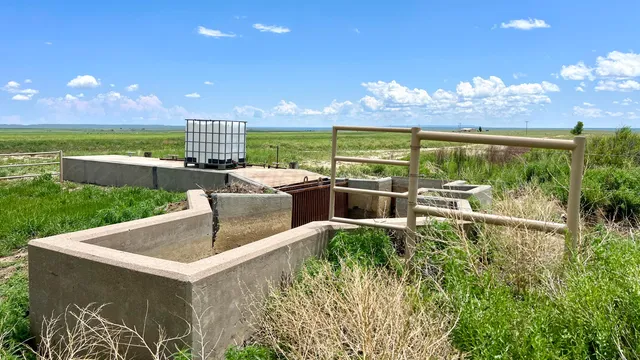 a view of an ocean and a mountain