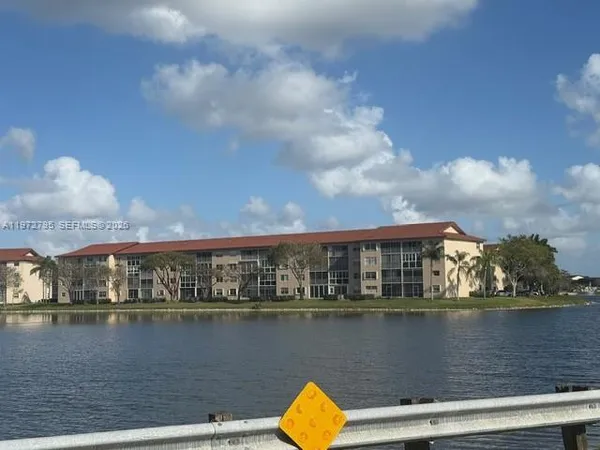 a view of swimming pool next to a lake view