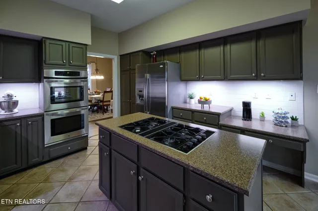 a kitchen with a stove and a sink