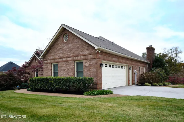 a view of house with a yard