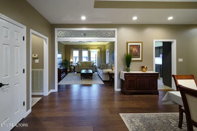 a lobby with furniture and a wooden floor