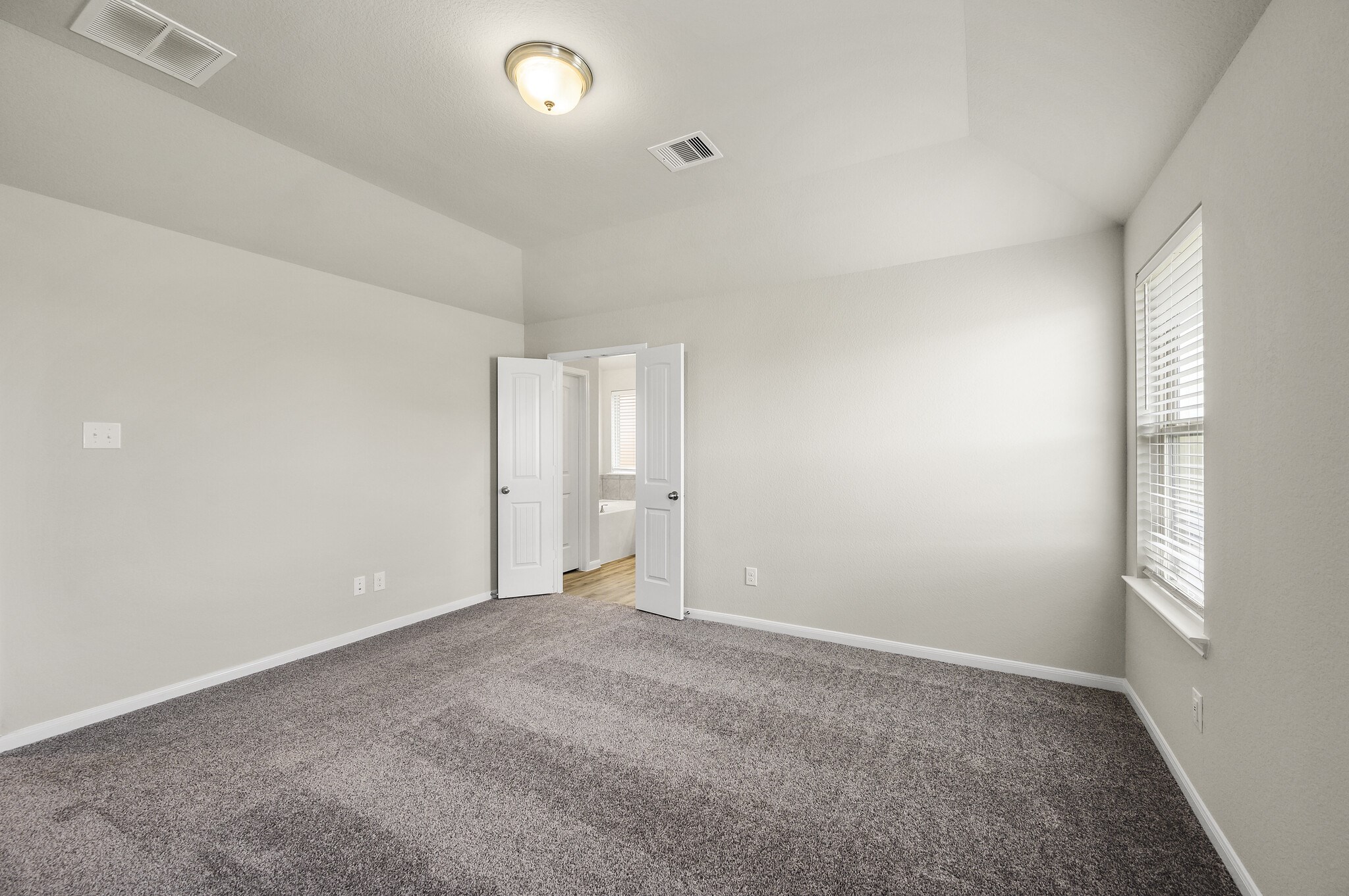 4507 Frontier Trail Baytown, TX 77521 - Photo 12 of 24 an empty room with windows