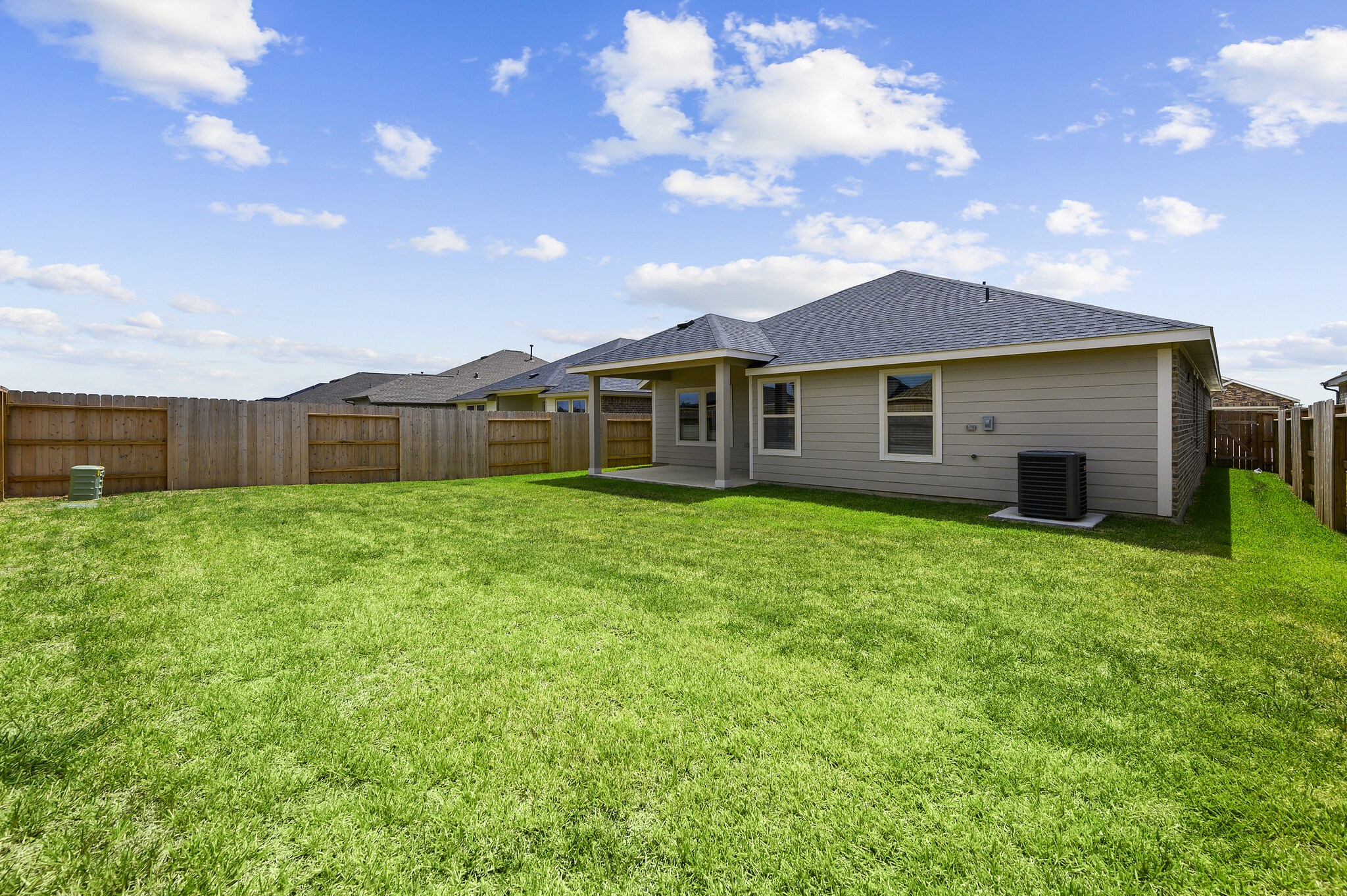 4507 Frontier Trail Baytown, TX 77521 - Photo 24 of 24 a view of a house with a backyard