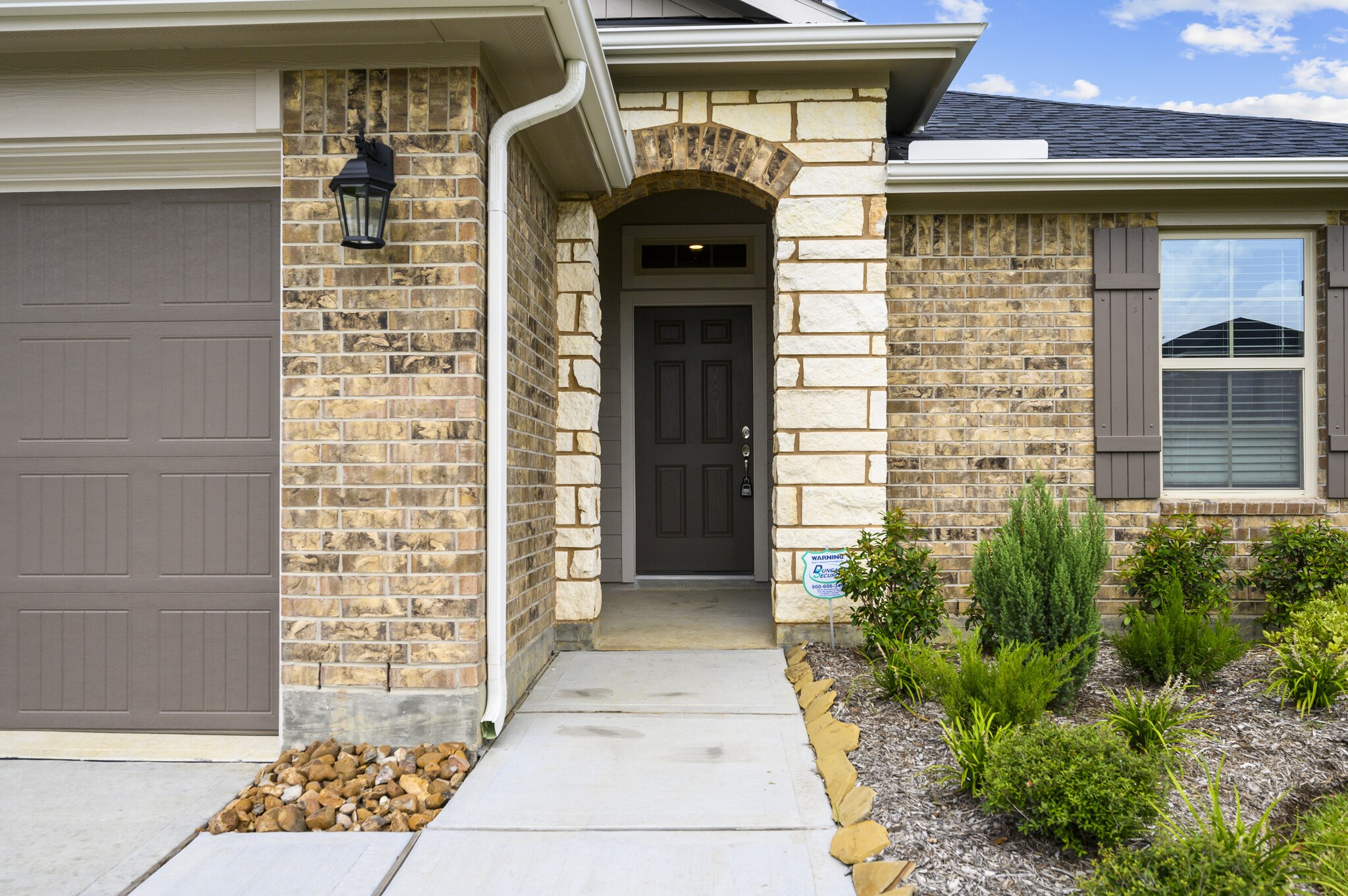 4507 Frontier Trail Baytown, TX 77521 - Photo 4 of 24 a front view of a house with a many windows