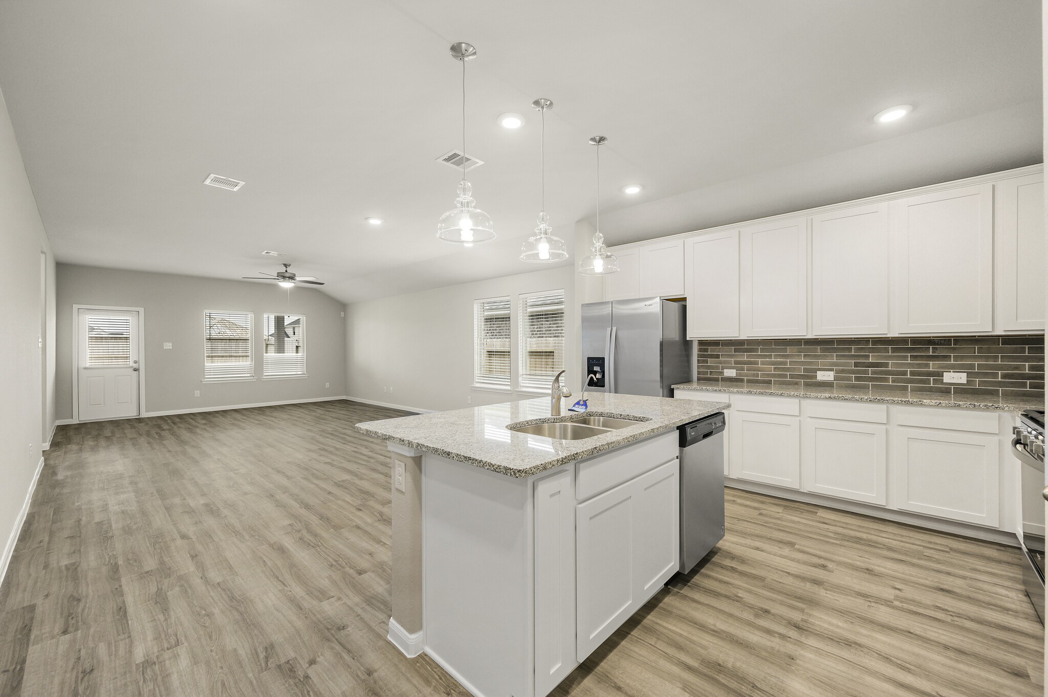 4507 Frontier Trail Baytown, TX 77521 - Photo 5 of 24 a kitchen with a sink stove and cabinets