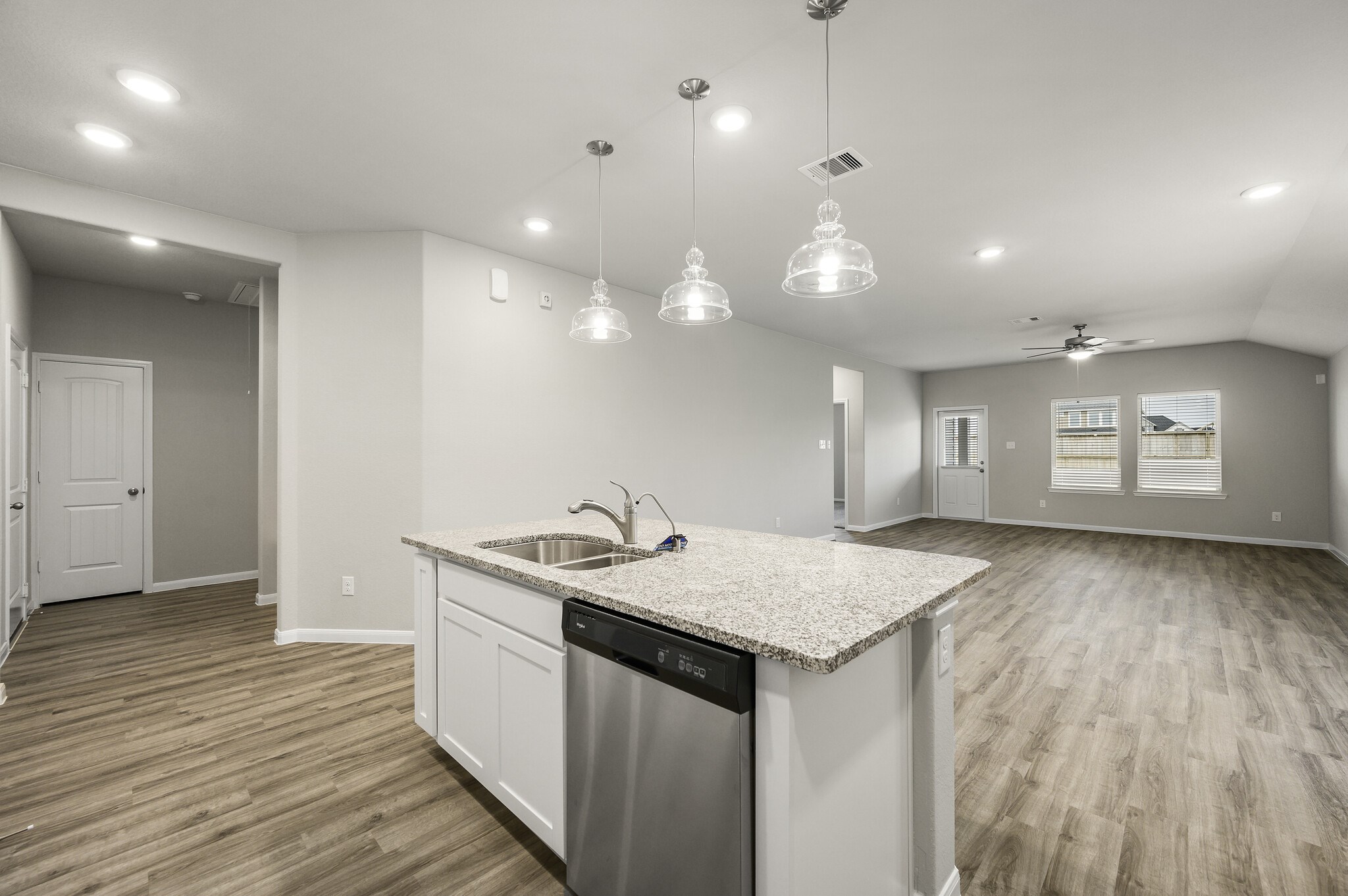 4507 Frontier Trail Baytown, TX 77521 - Photo 8 of 24 a kitchen with a sink and chandelier