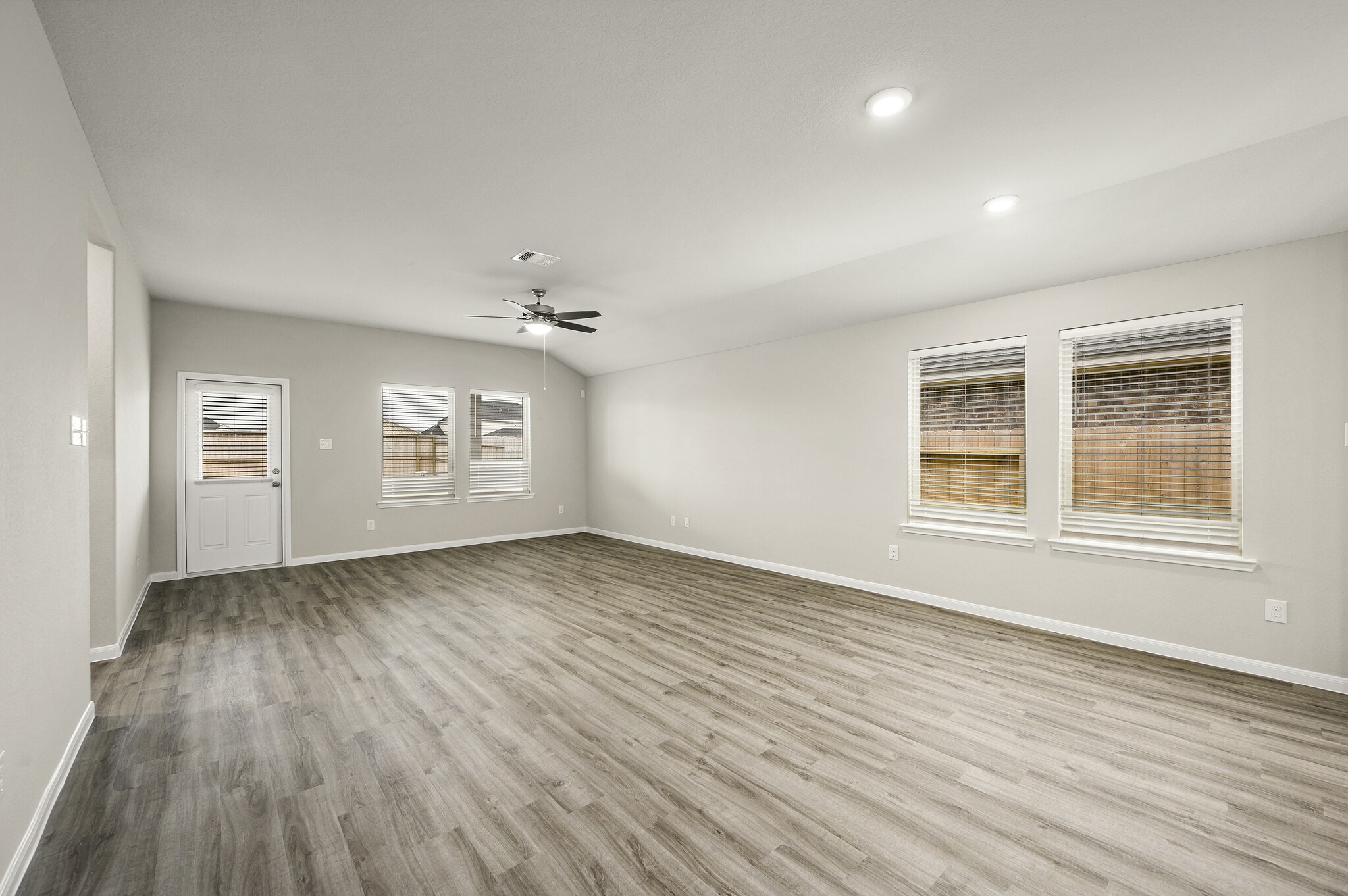 4507 Frontier Trail Baytown, TX 77521 - Photo 9 of 24 wooden floor in an empty room with a window