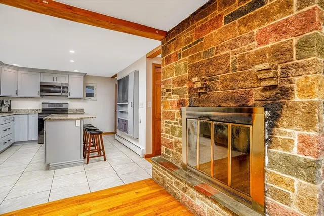 a open kitchen with granite countertop a sink and cabinets
