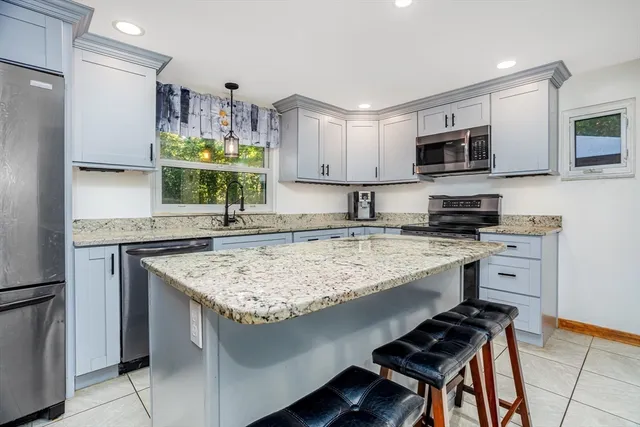 a kitchen with a table and chairs in it