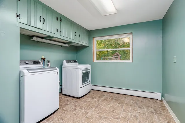 a view of a house with backyard tub and sitting area