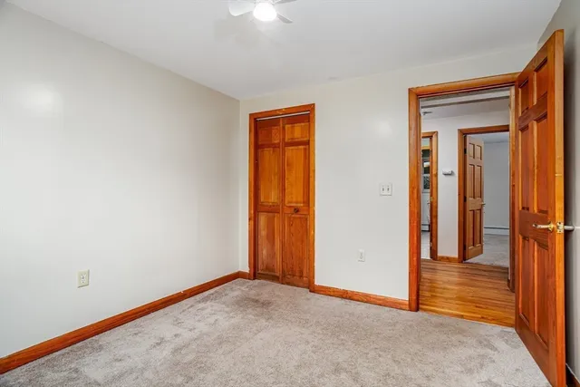 a view of a patio with a table chairs and a backyard