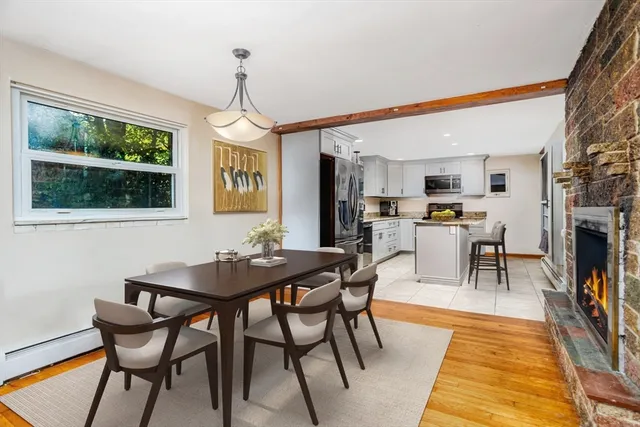 a dining room with furniture and window