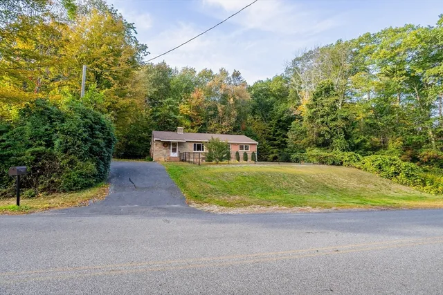 a house with swimming pool in front of it