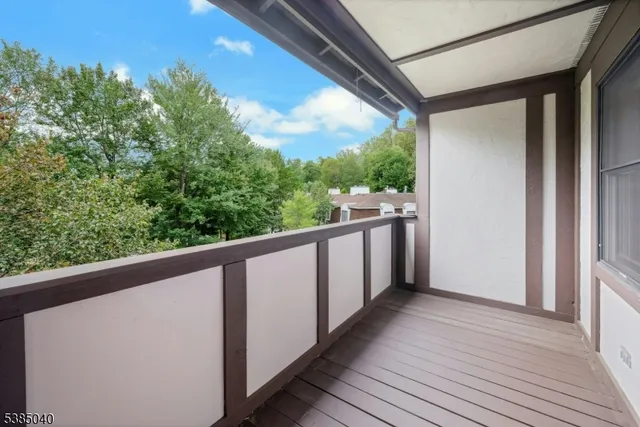 a view of balcony with wooden floor