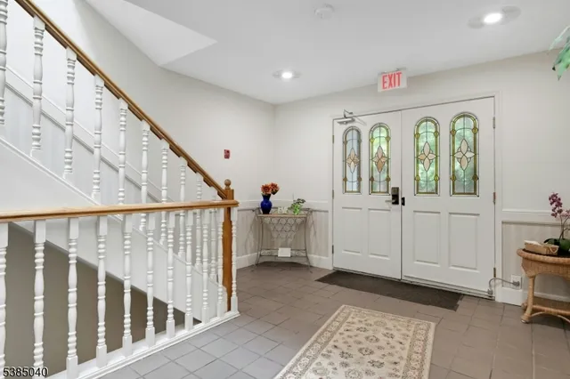 a view of entryway with wooden floor