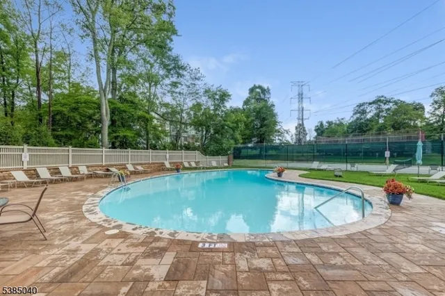 a view of a swimming pool with a yard