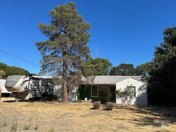 a view of a house with a snow in the yard
