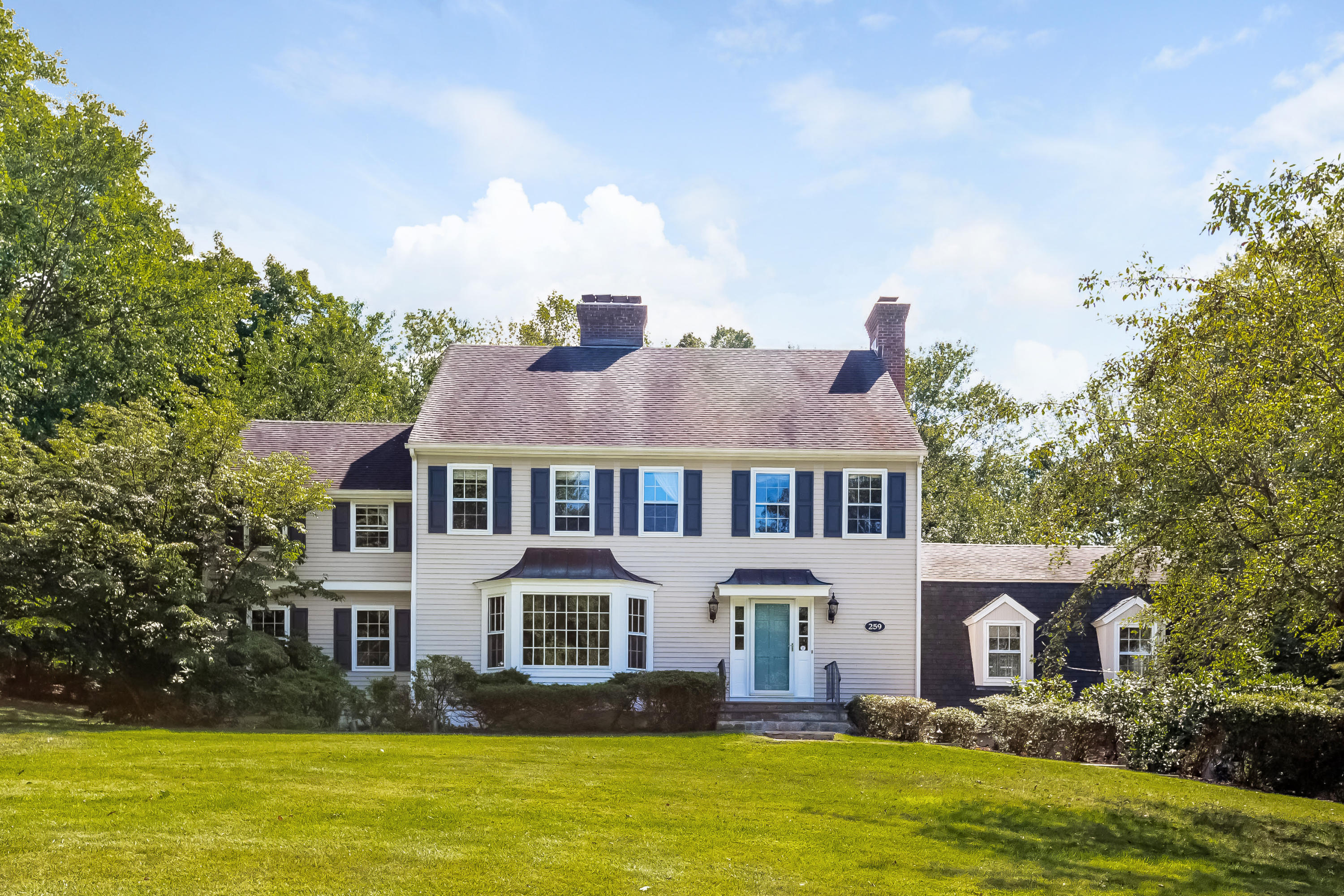 a front view of a house with a swimming pool