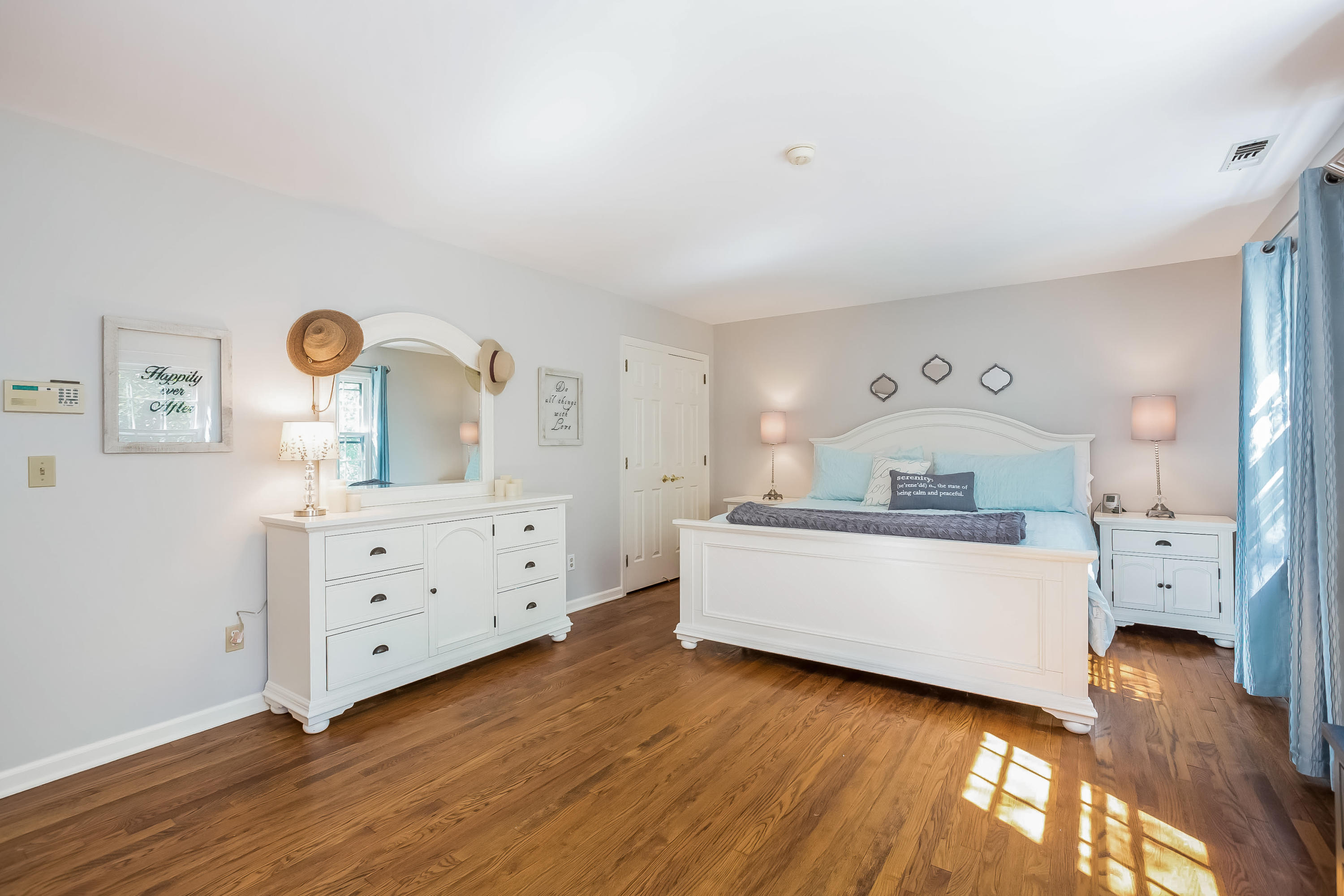 259 Marvin Ridge Road New Canaan, CT 06840 - Photo 14 of 38 a room with painting on the wall and a dresser
