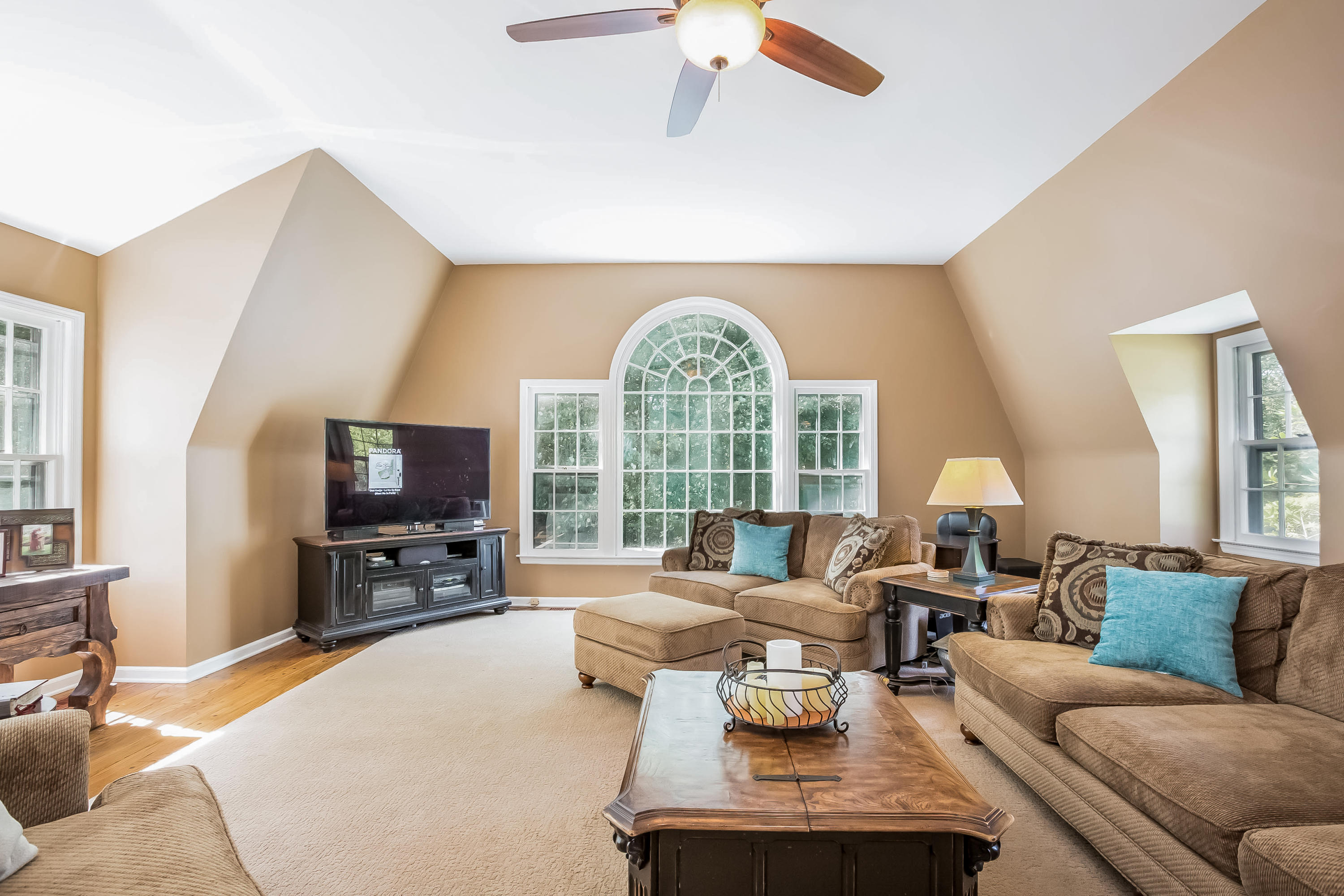 259 Marvin Ridge Road New Canaan, CT 06840 - Photo 10 of 38 a living room with furniture a flat screen tv and a large window