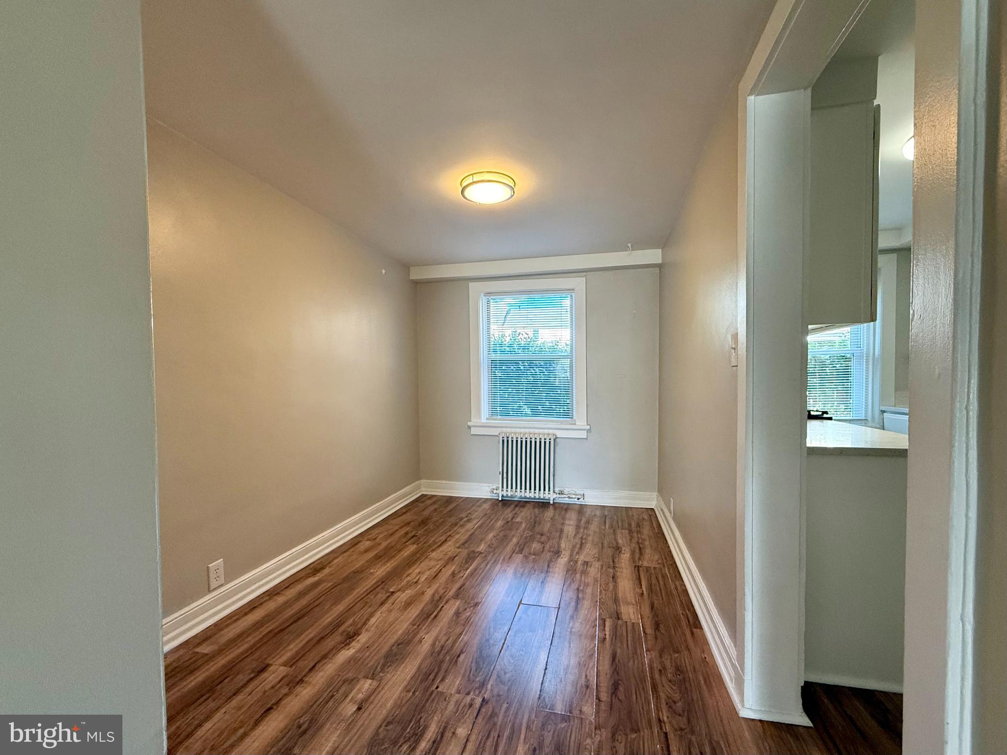 1400 Kenmore Avenue, Unit E1 Fredericksburg, VA 22401 - Photo 4 of 11 a view of room with window and wooden floor
