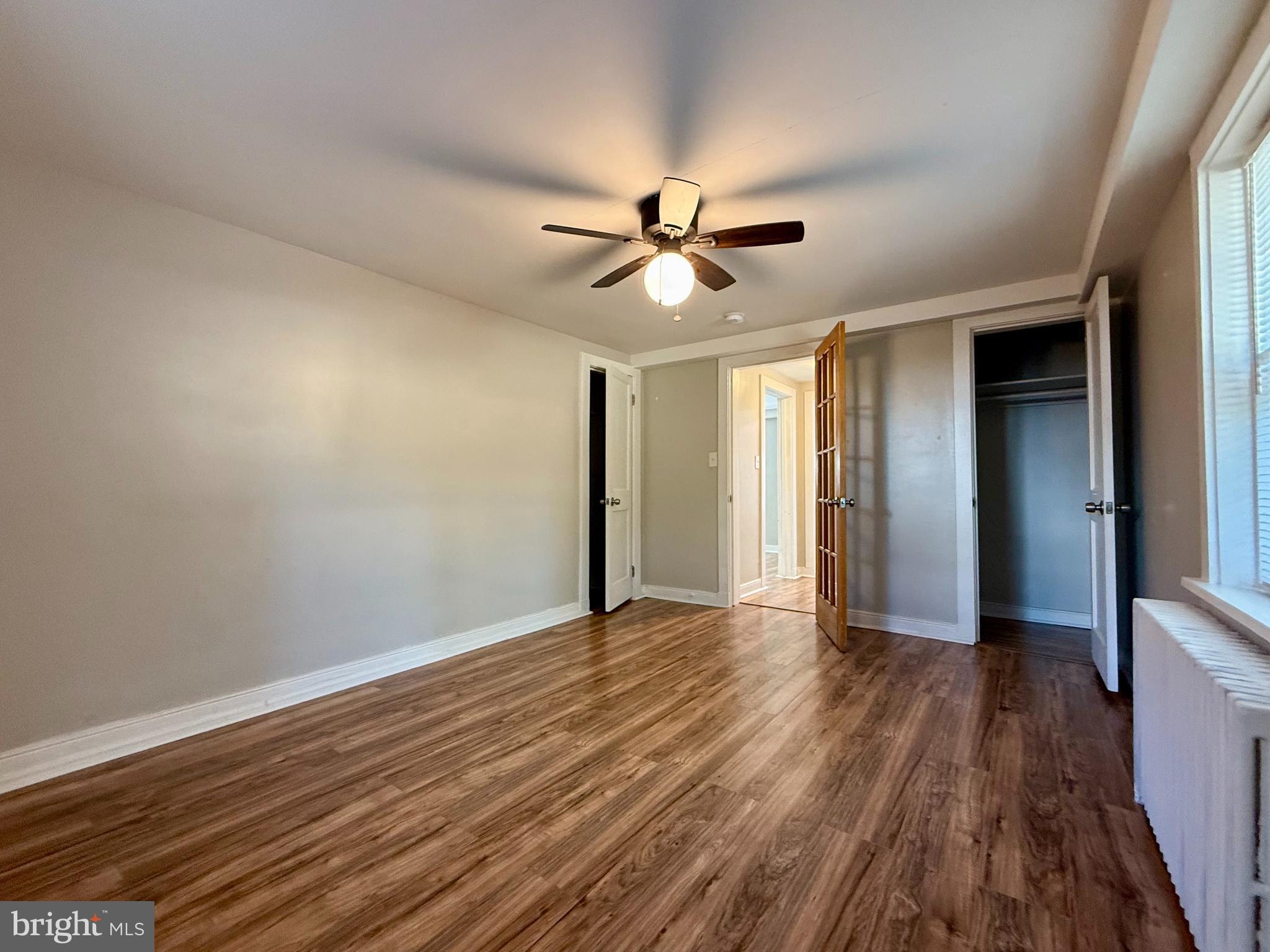 1400 Kenmore Avenue, Unit E1 Fredericksburg, VA 22401 - Photo 8 of 11 wooden floor in an empty room with a window