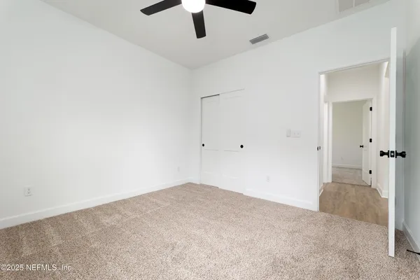 an empty room with fan