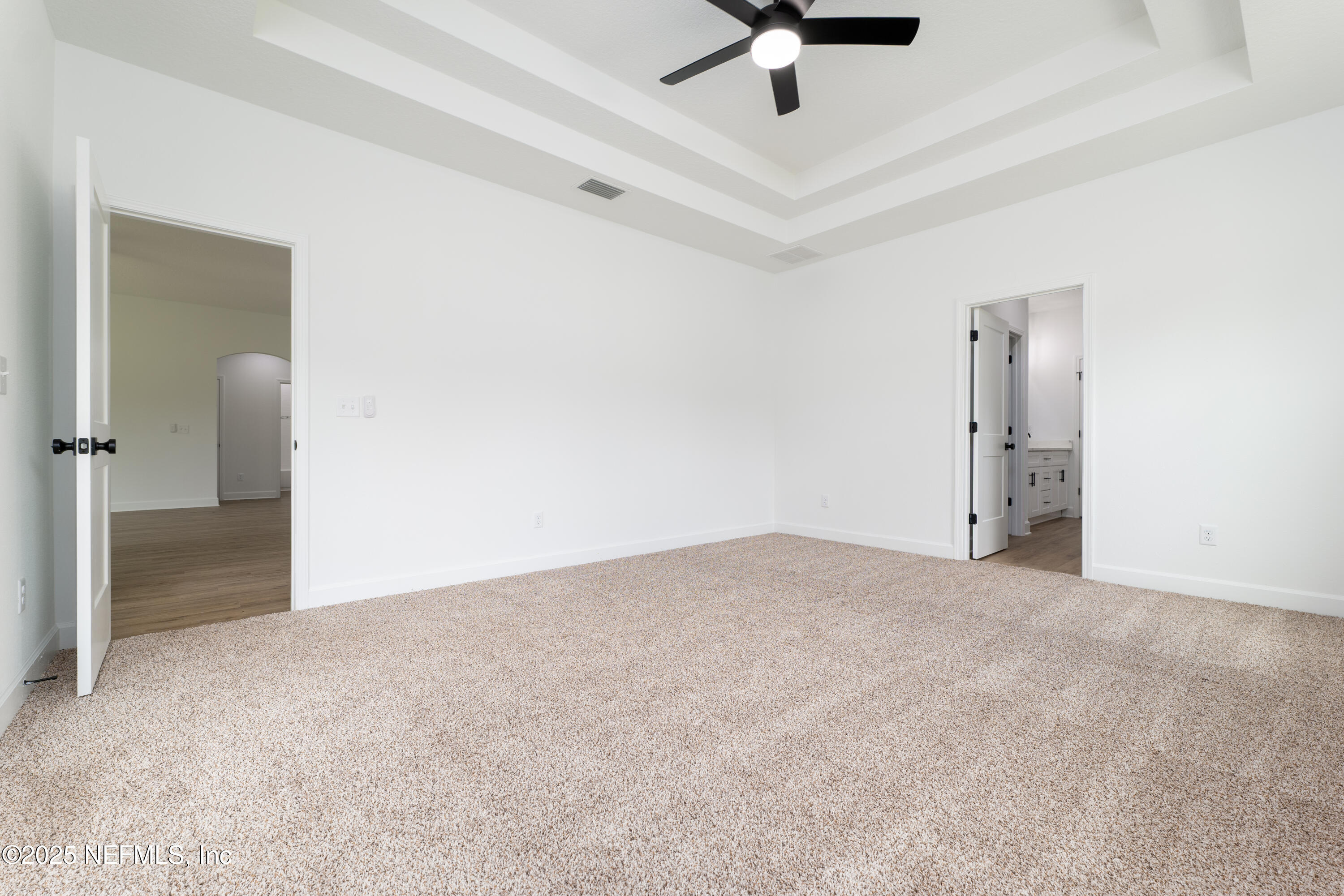 2482 Oleander Avenue Middleburg, FL 32068 - Photo 26 of 34 an empty room with fan and entrance