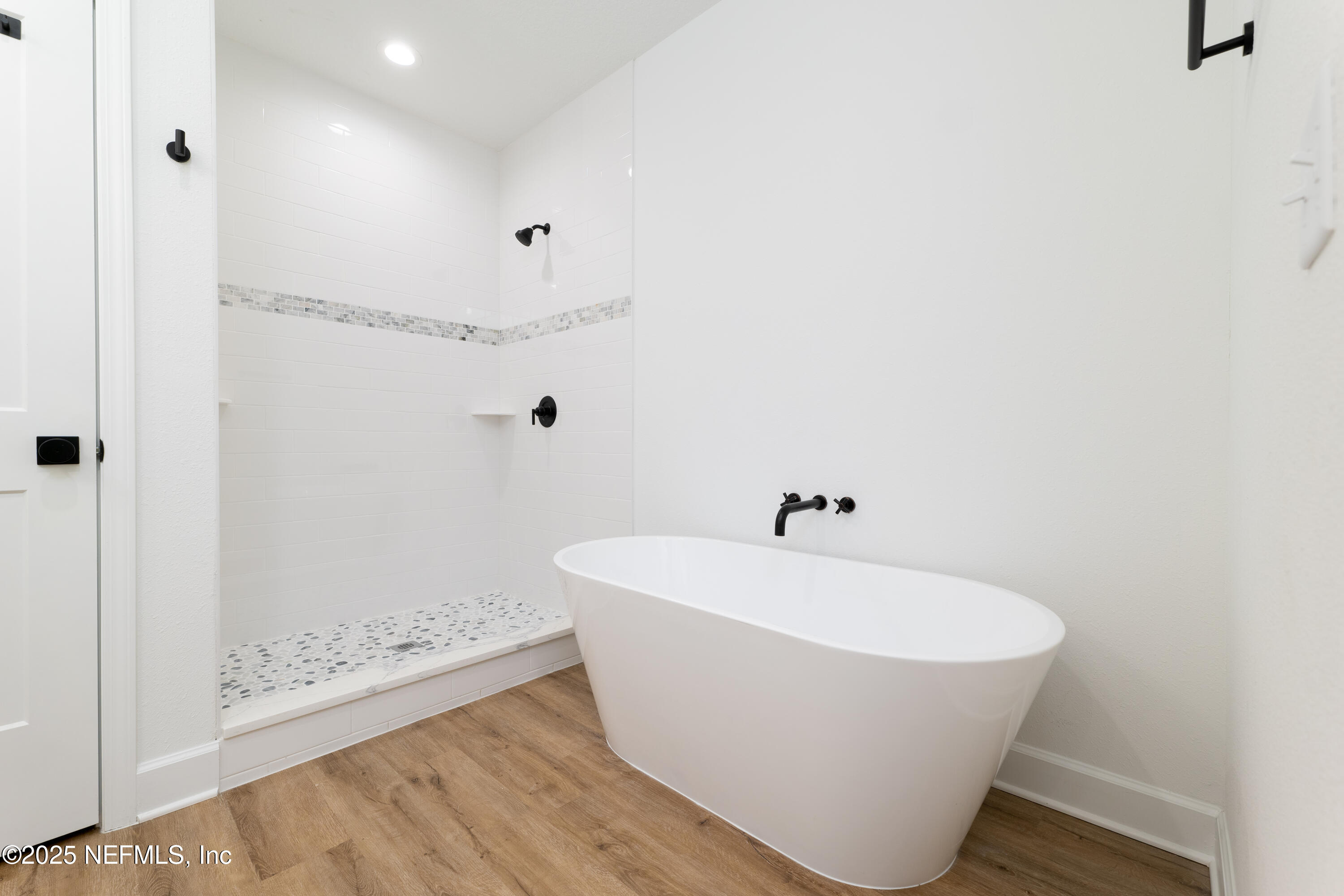 2482 Oleander Avenue Middleburg, FL 32068 - Photo 27 of 34 a white bath tub sitting in a bathroom