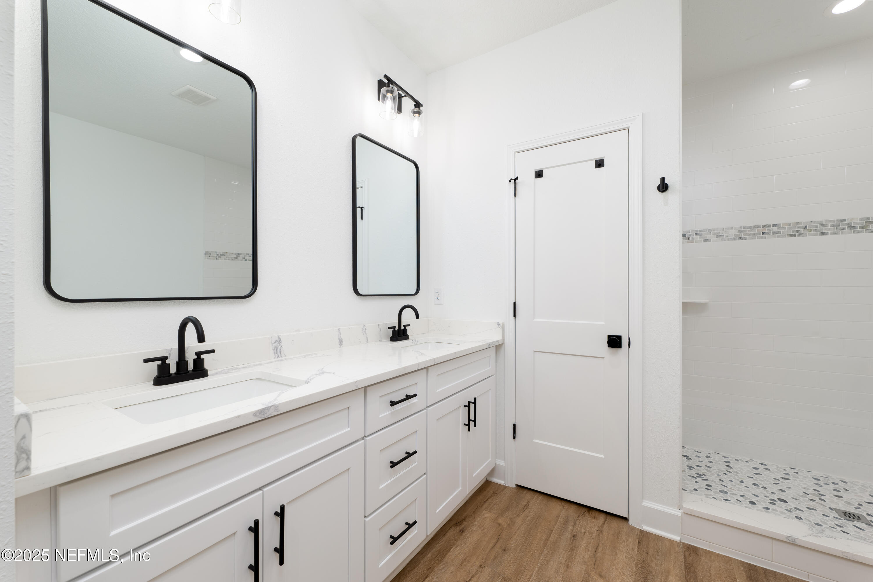 2482 Oleander Avenue Middleburg, FL 32068 - Photo 28 of 34 a bathroom with a double vanity sink mirror and
