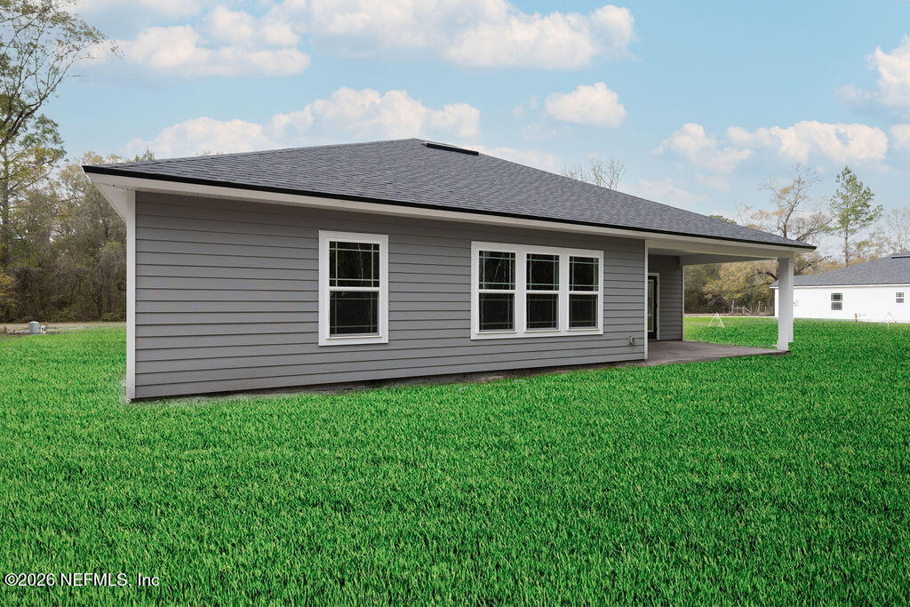 2482 Oleander Avenue Middleburg, FL 32068 - Photo 34 of 34 a front view of a house with garden