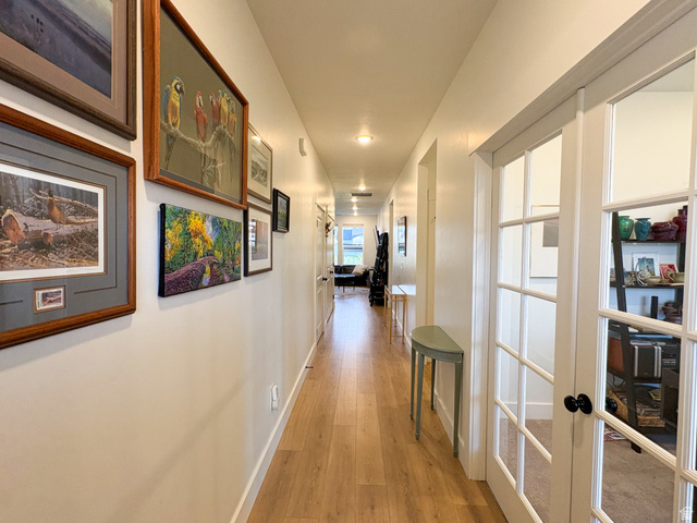 412 West 3025th Street South Logan, UT 84321 - Photo 13 of 34 Corridor with light wood finished floors and baseboards