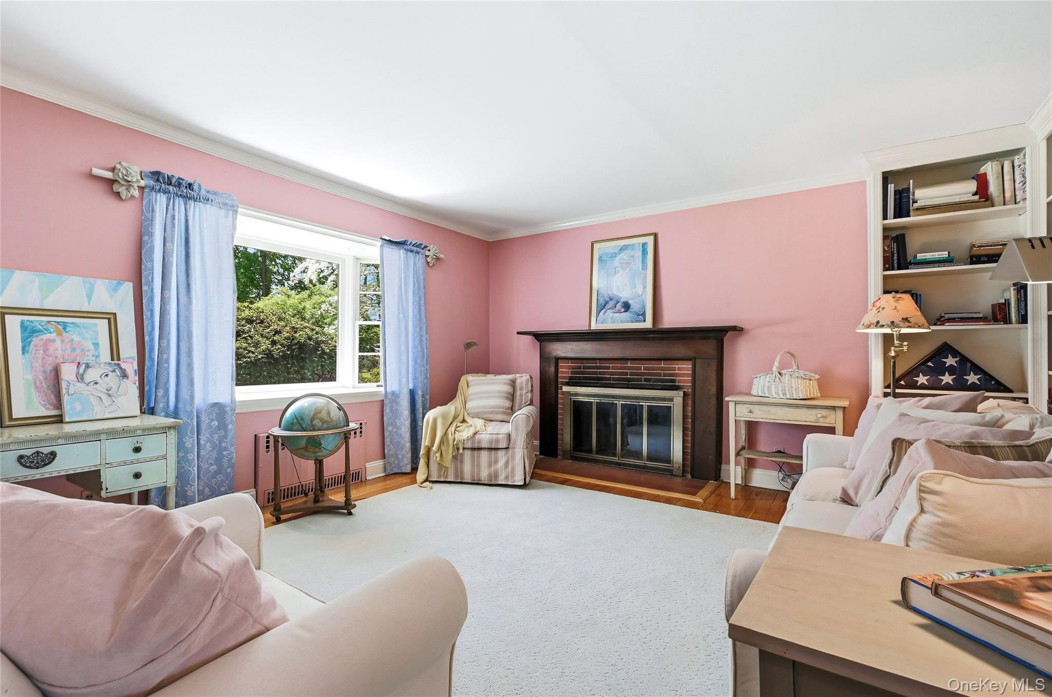 9 Townsend Road Glen Cove, NY 11542 - Photo 11 of 48 a living room with furniture and a fireplace