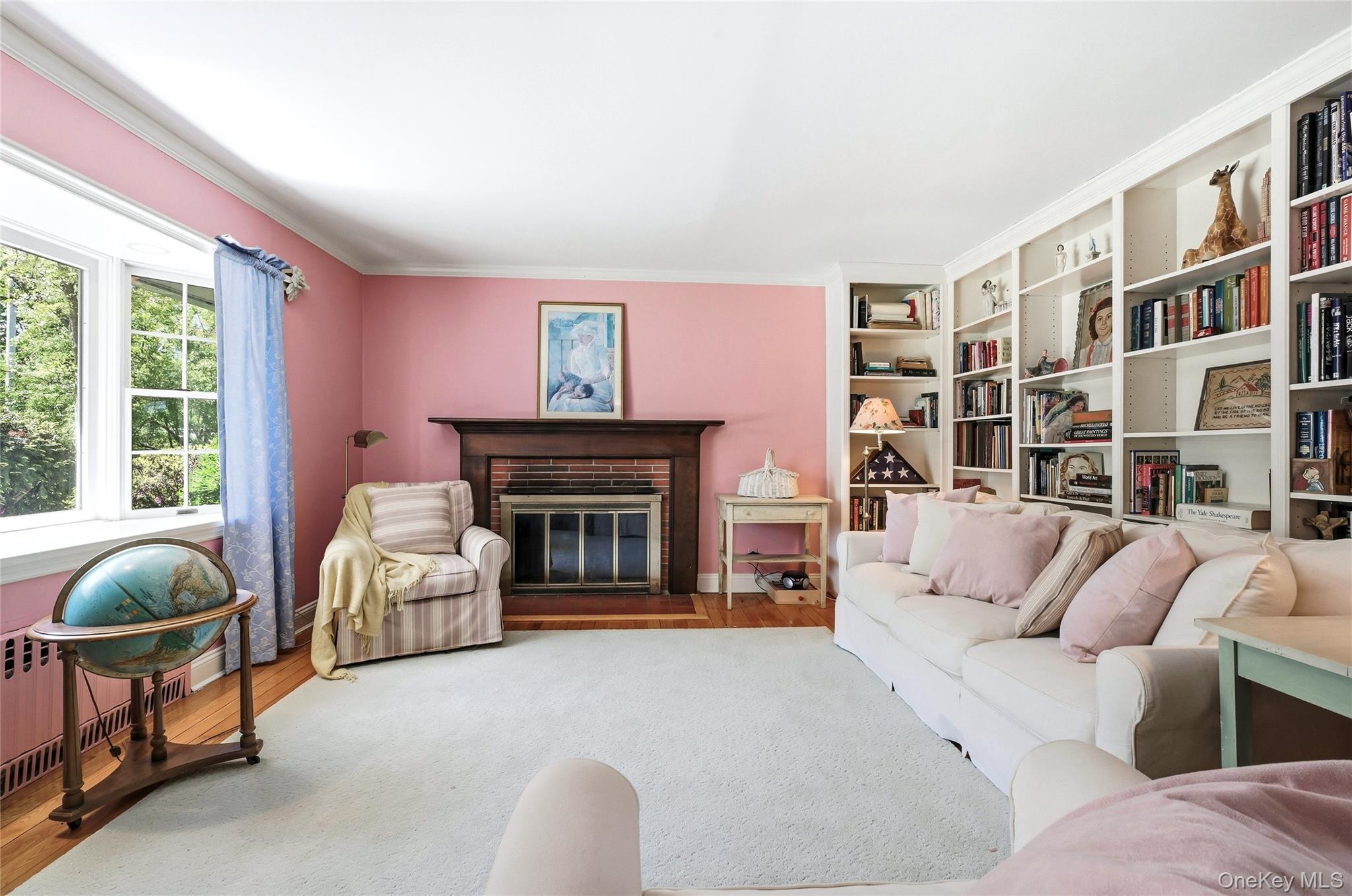 9 Townsend Road Glen Cove, NY 11542 - Photo 12 of 48 a living room with furniture and a fireplace