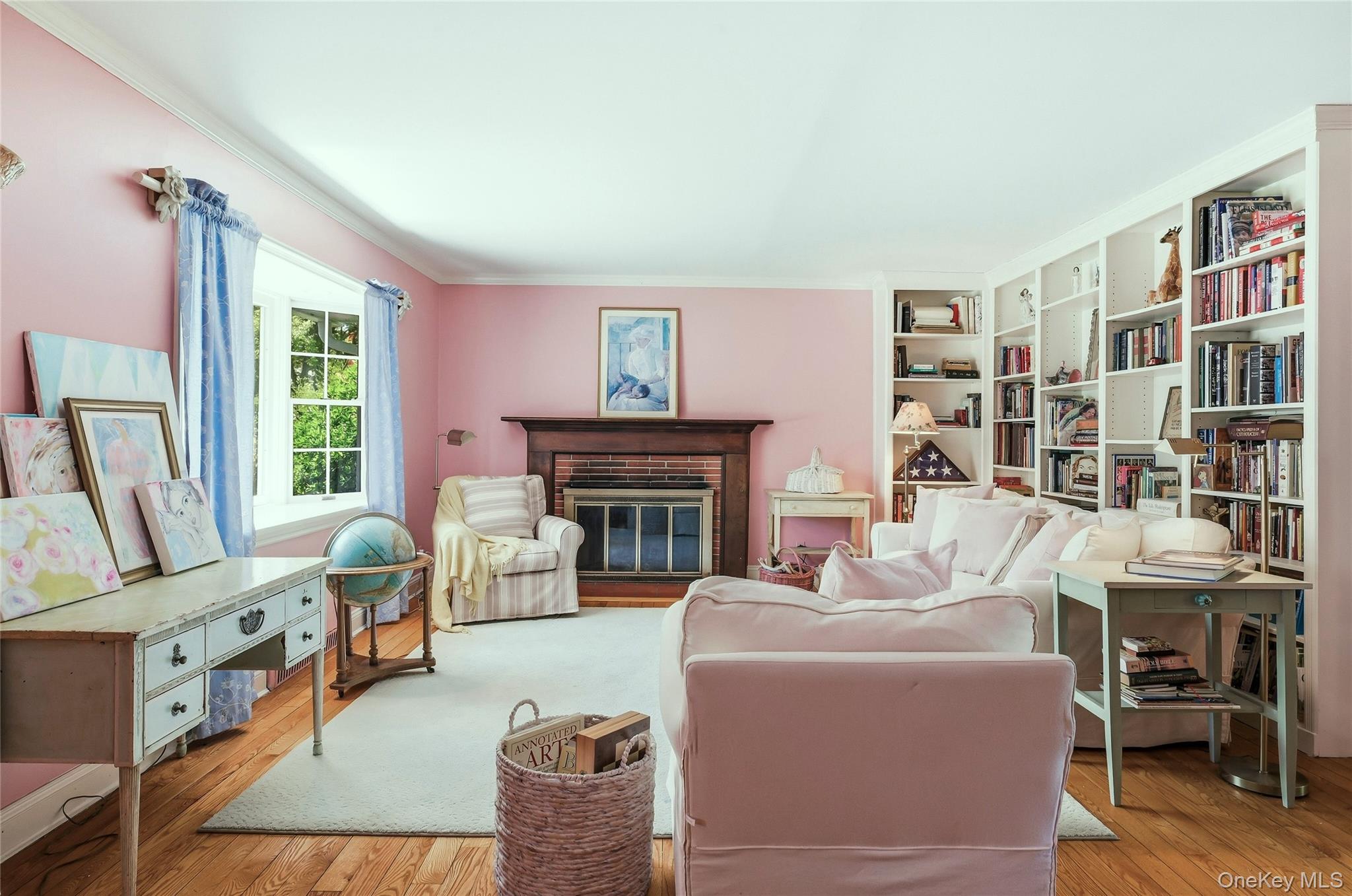 9 Townsend Road Glen Cove, NY 11542 - Photo 13 of 48 a living room with furniture a fireplace and a large window