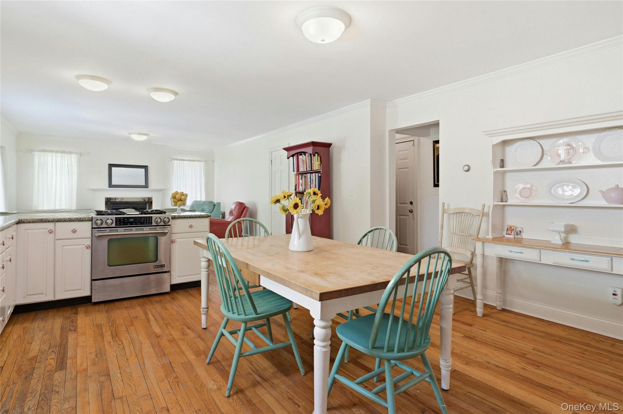 9 Townsend Road Glen Cove, NY 11542 - Photo 22 of 48 a kitchen with white cabinets and stainless steel appliances